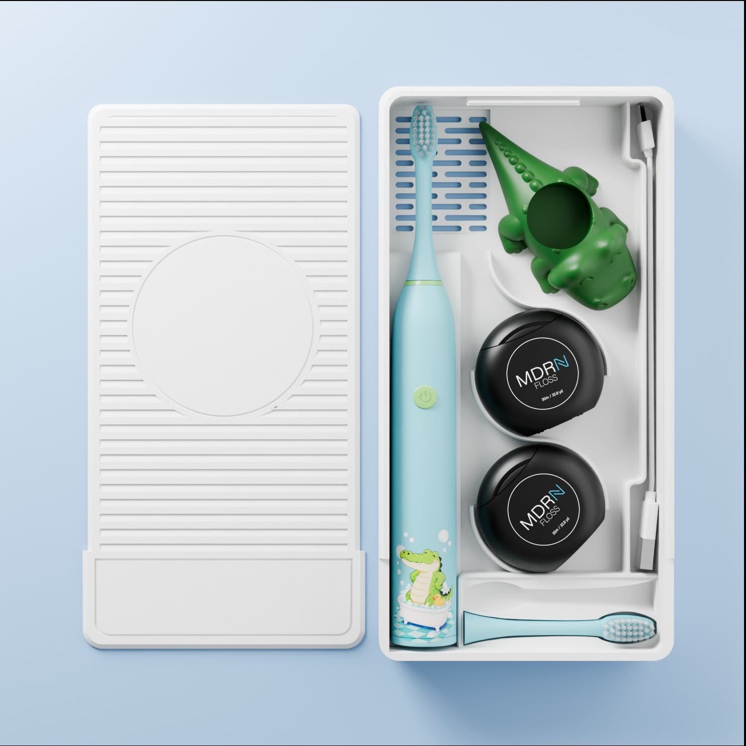Blue kids dental box with crocodile toothbrush and floss kit