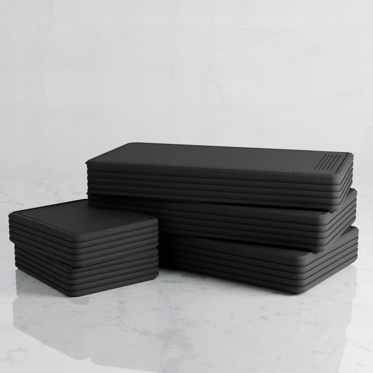 Stack of closed black dental kits